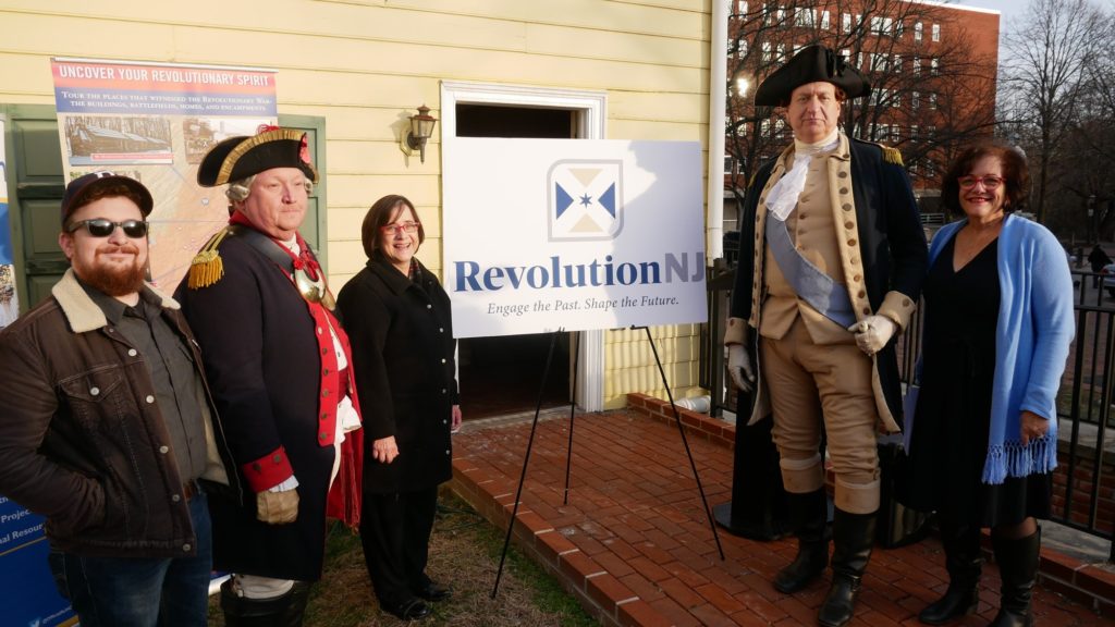 The winning entry in the Revolution NJ logo contest was unveiled by General George Washington and Colonel Henry Knox following the Second Battle of Trenton reenactment in Trenton’s Mill Hill Park on December 28.